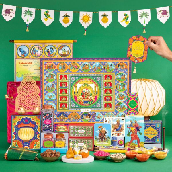Phool Ramayana Diwali Gifbox - 15 Item Hamper - Contains Tara Sitara Lamp, Toran, Golden emborssed Diya, Incense, Dry fruit Nuts and Saunf, Playing cards, Brass diya set, Ramayana Map- All in Patola Tray. Premium Diwali Gift Hamper